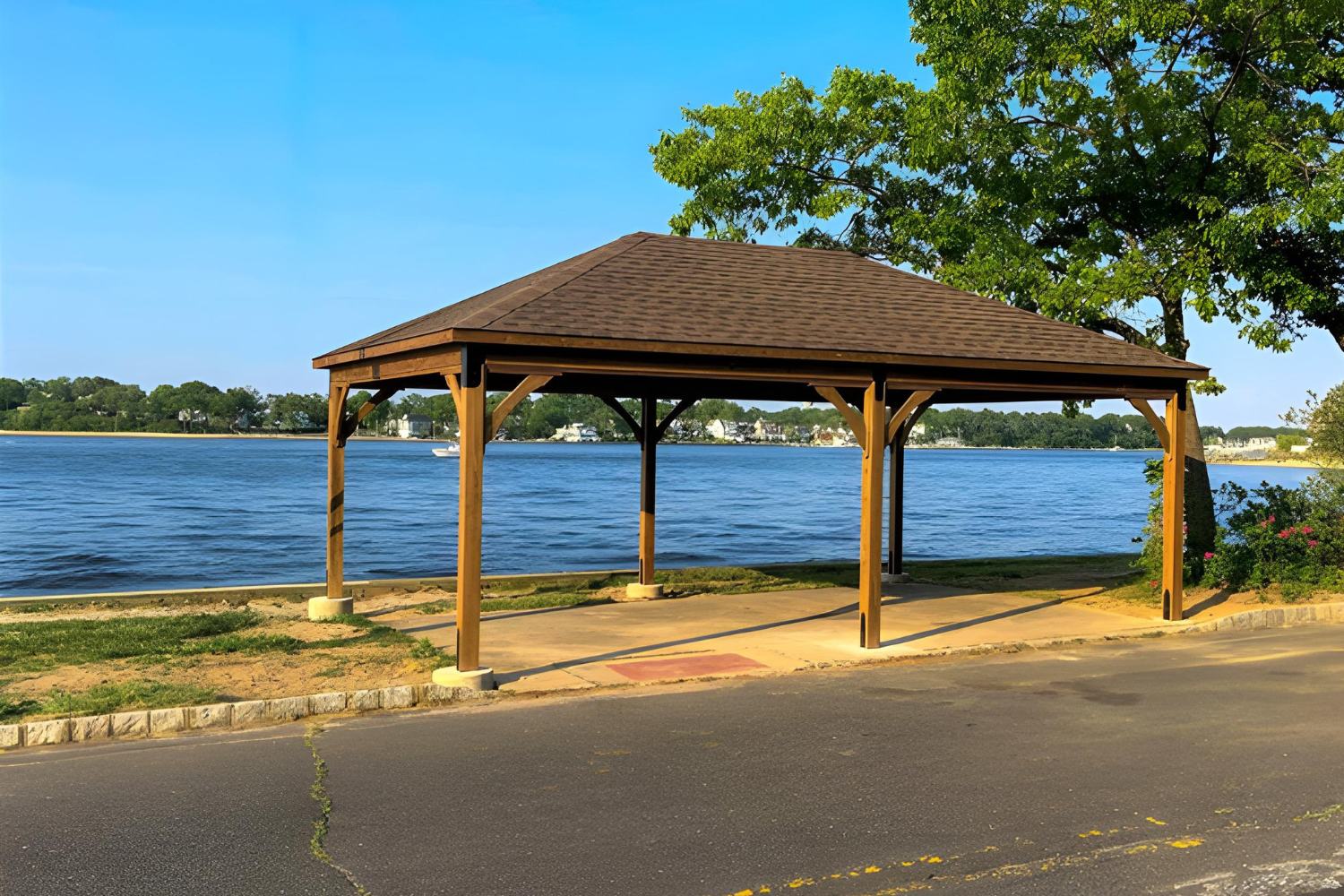 Lakefront natural wood pavilion with post-and-beam design by Waterloo Structure in southeastern PA