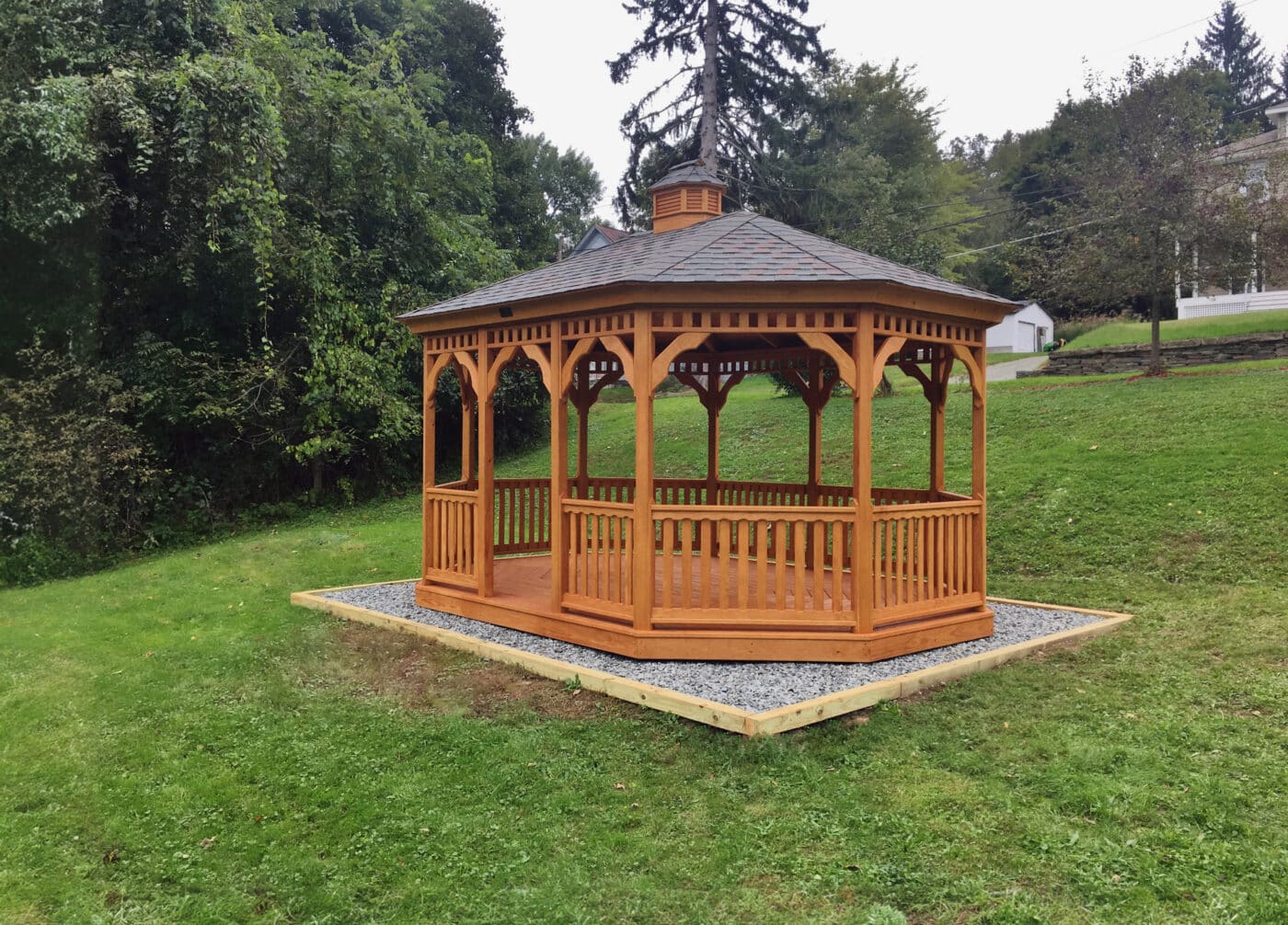 Wood oval gazebo in a garden setting by Waterloo Structure serving New Jersey and Maryland